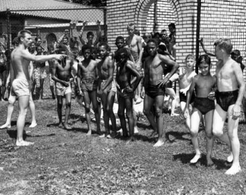 The original handwritten caption to this photo: "Negroes at Fairground Swimming Pool."
